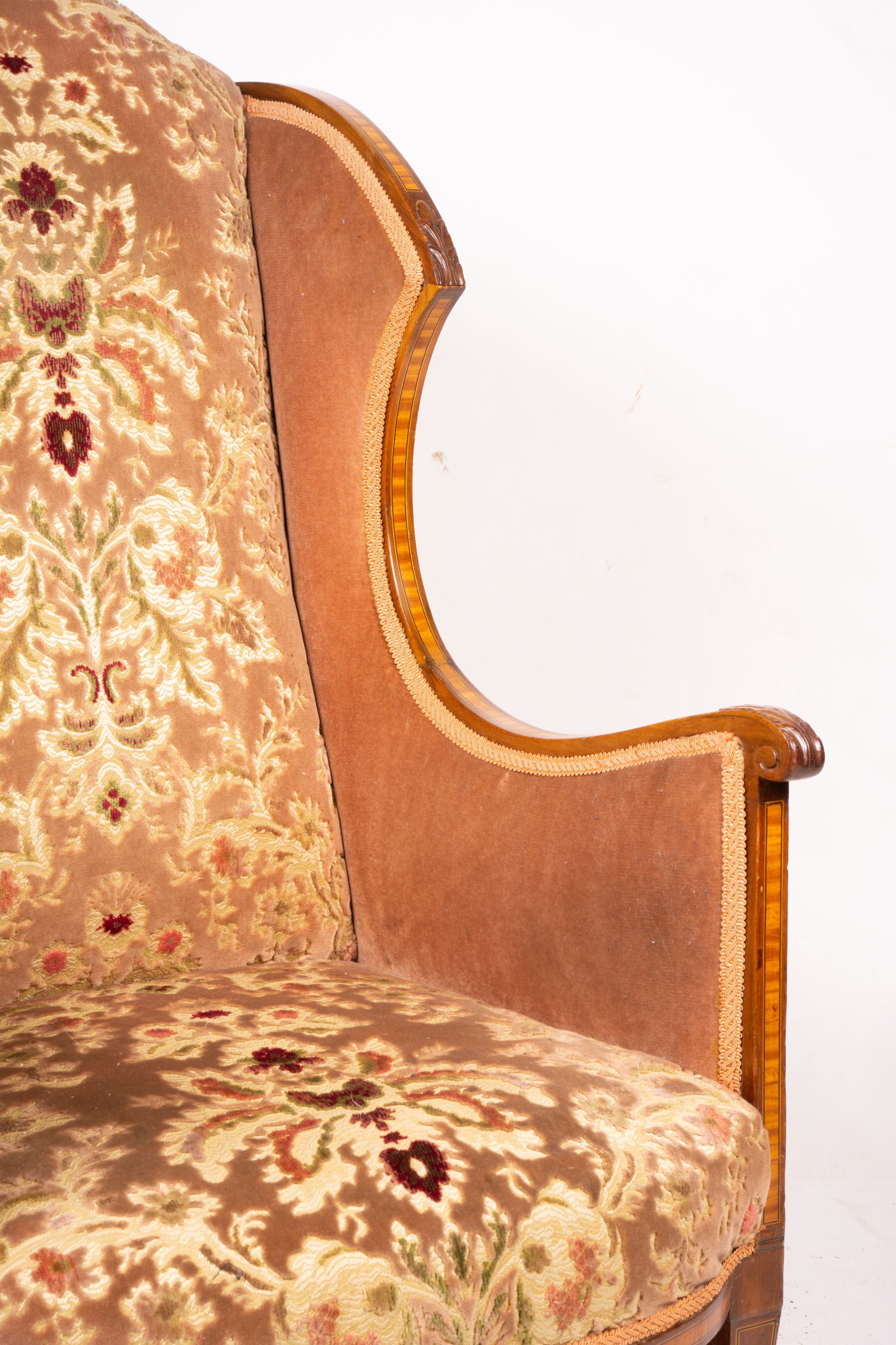 A pair of Edwardian satinwood banded mahogany wing armchairs, width 56cm, depth 75cm, height 110cm